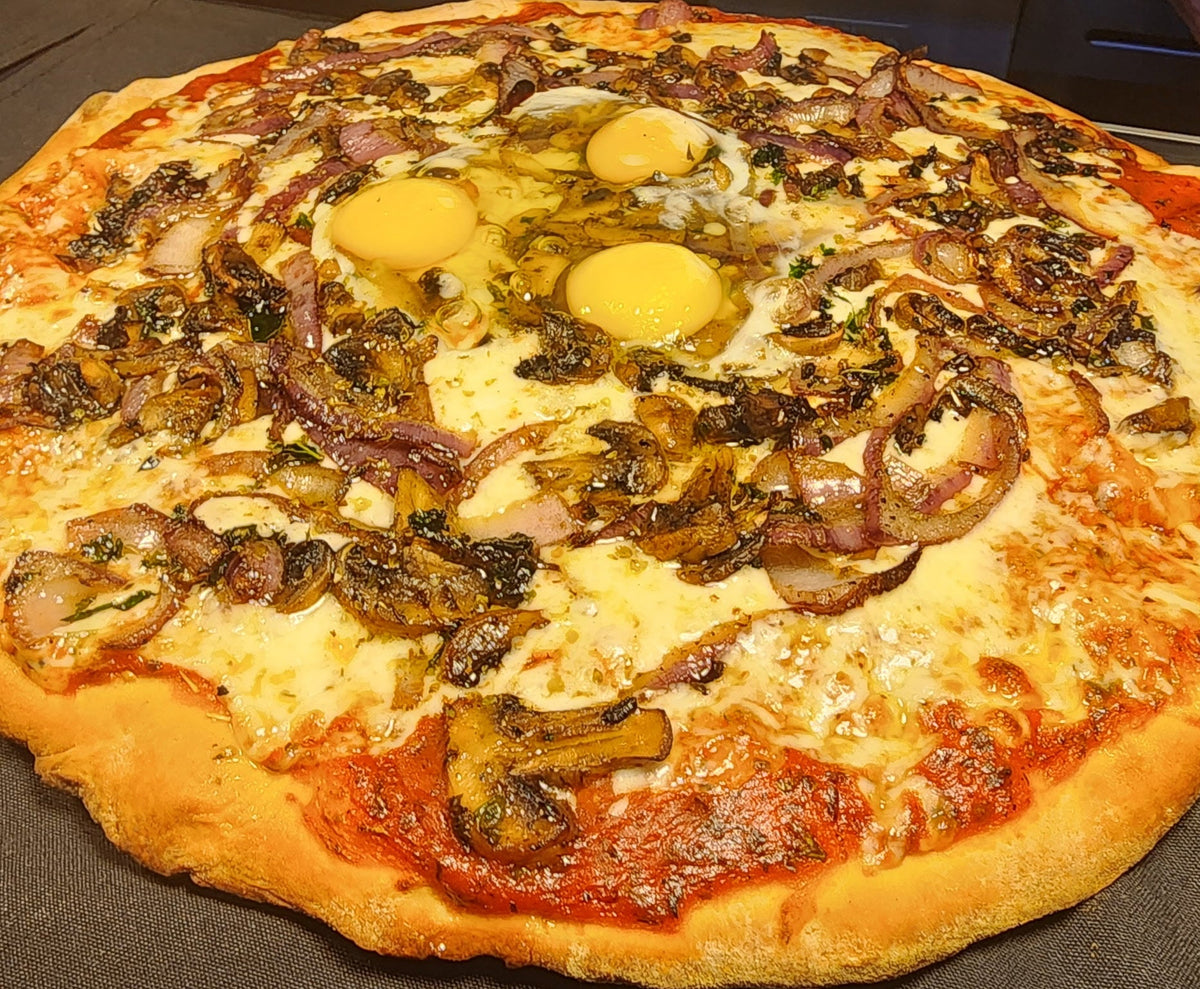 Pizza with various toppings on a countertop